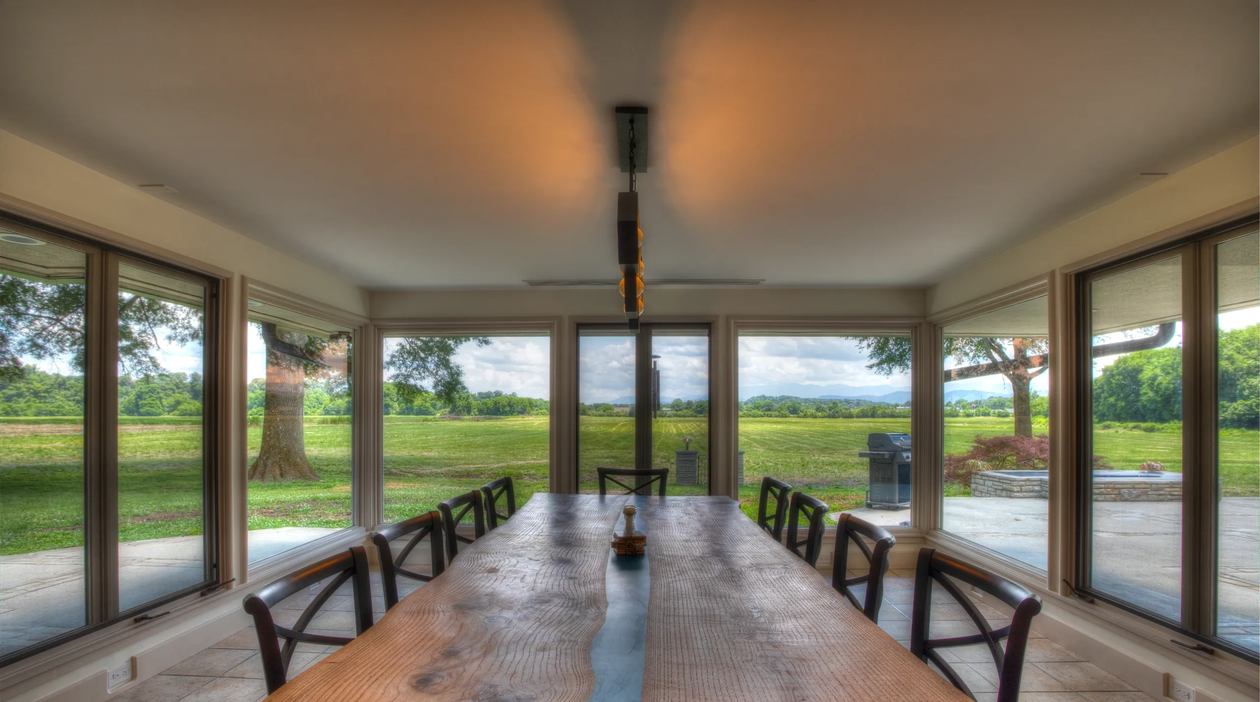 Dining room with large windows and view.