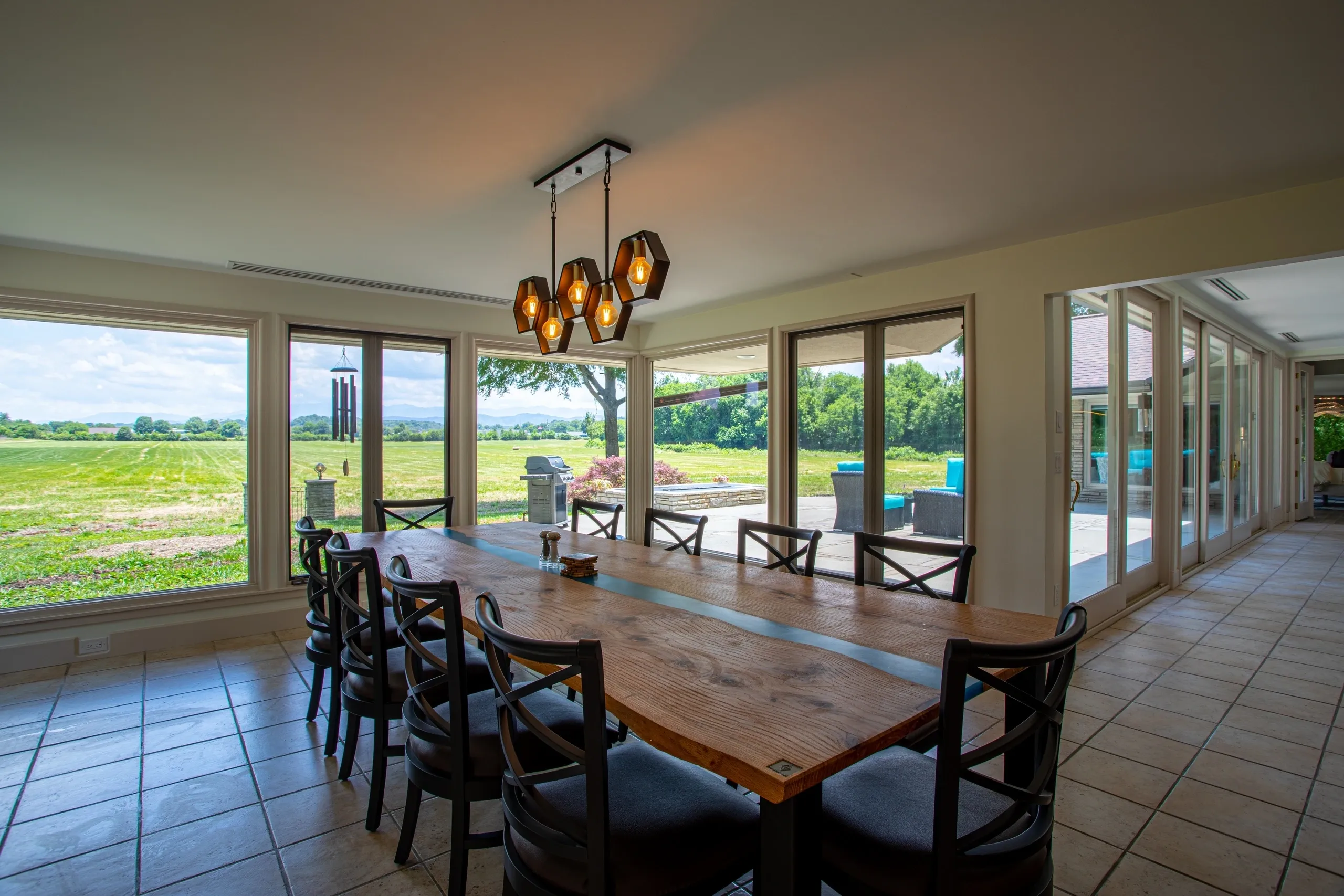 Dining room with large windows and view.