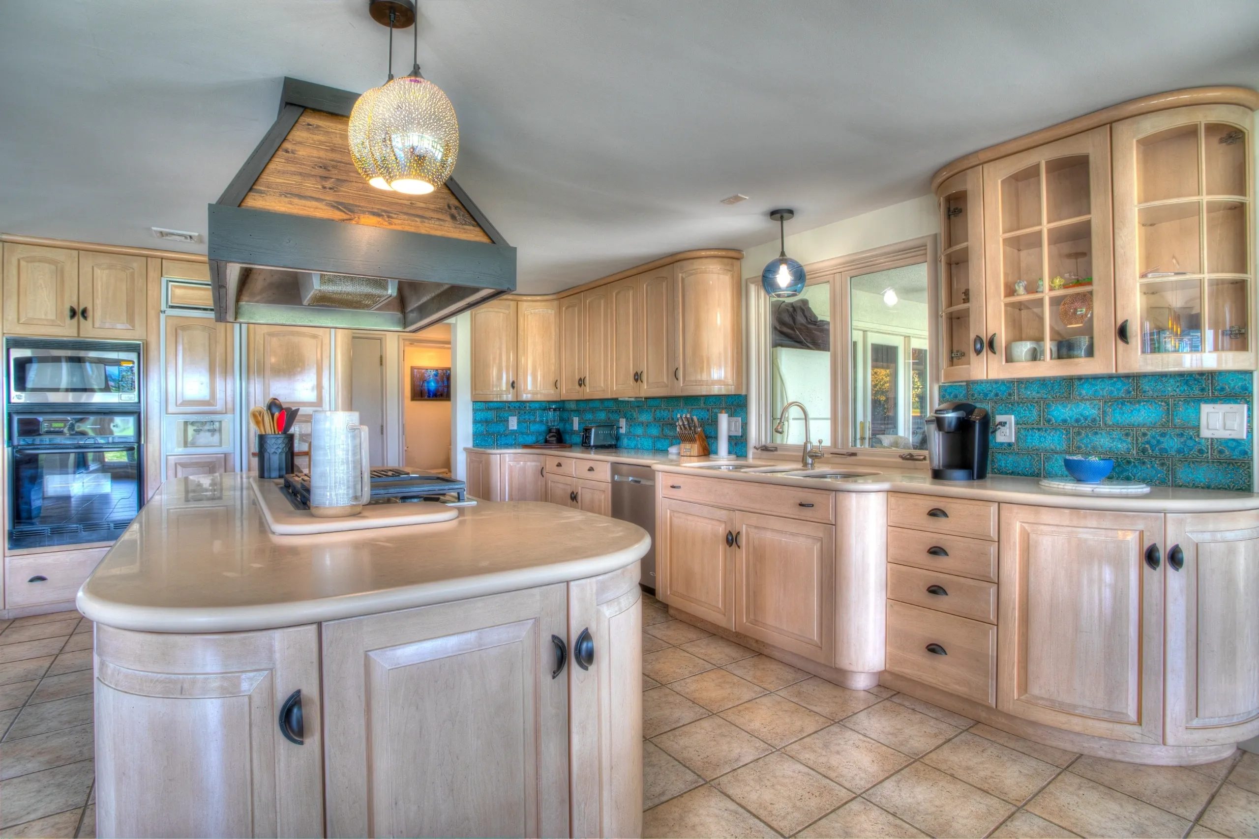 Spacious modern kitchen with wooden cabinets.