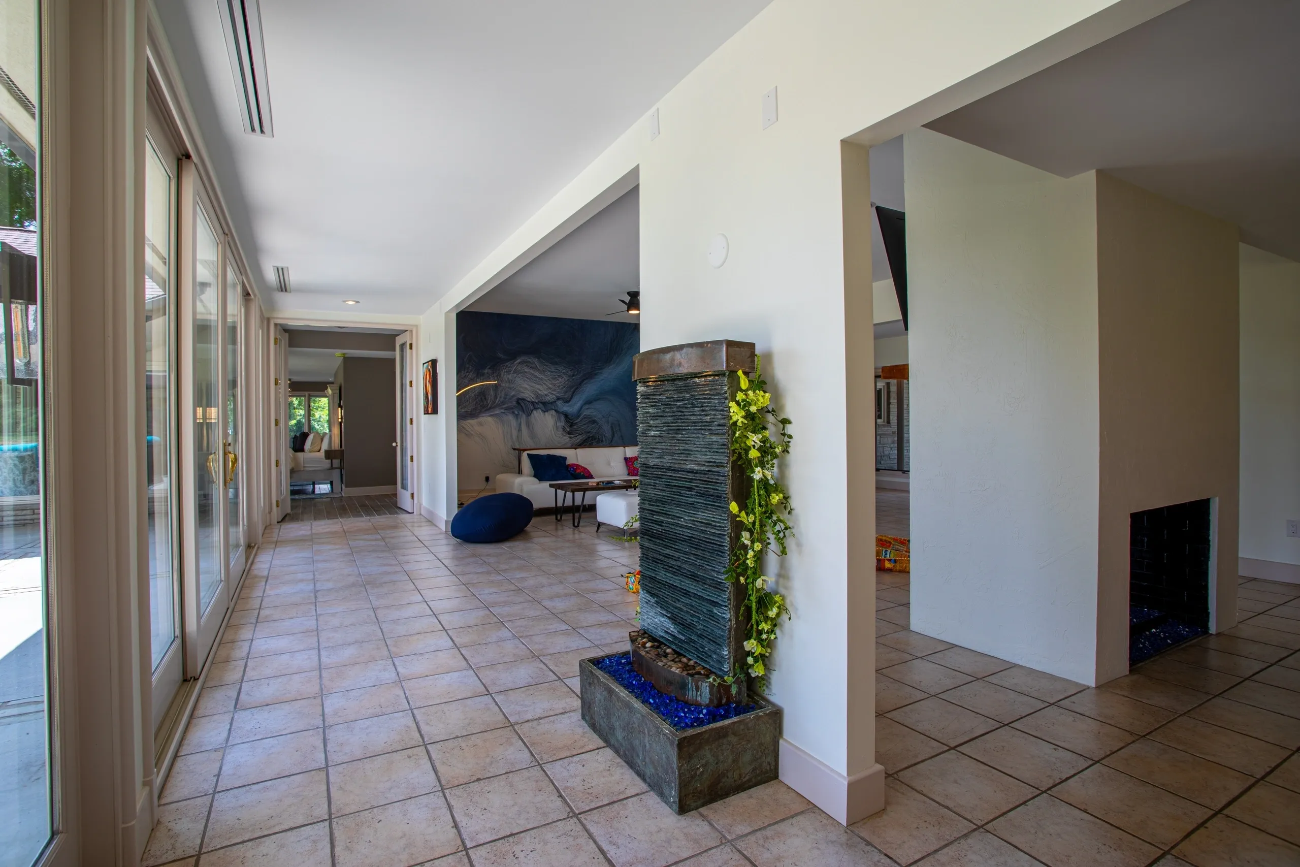 Modern living room with floor-to-ceiling windows.