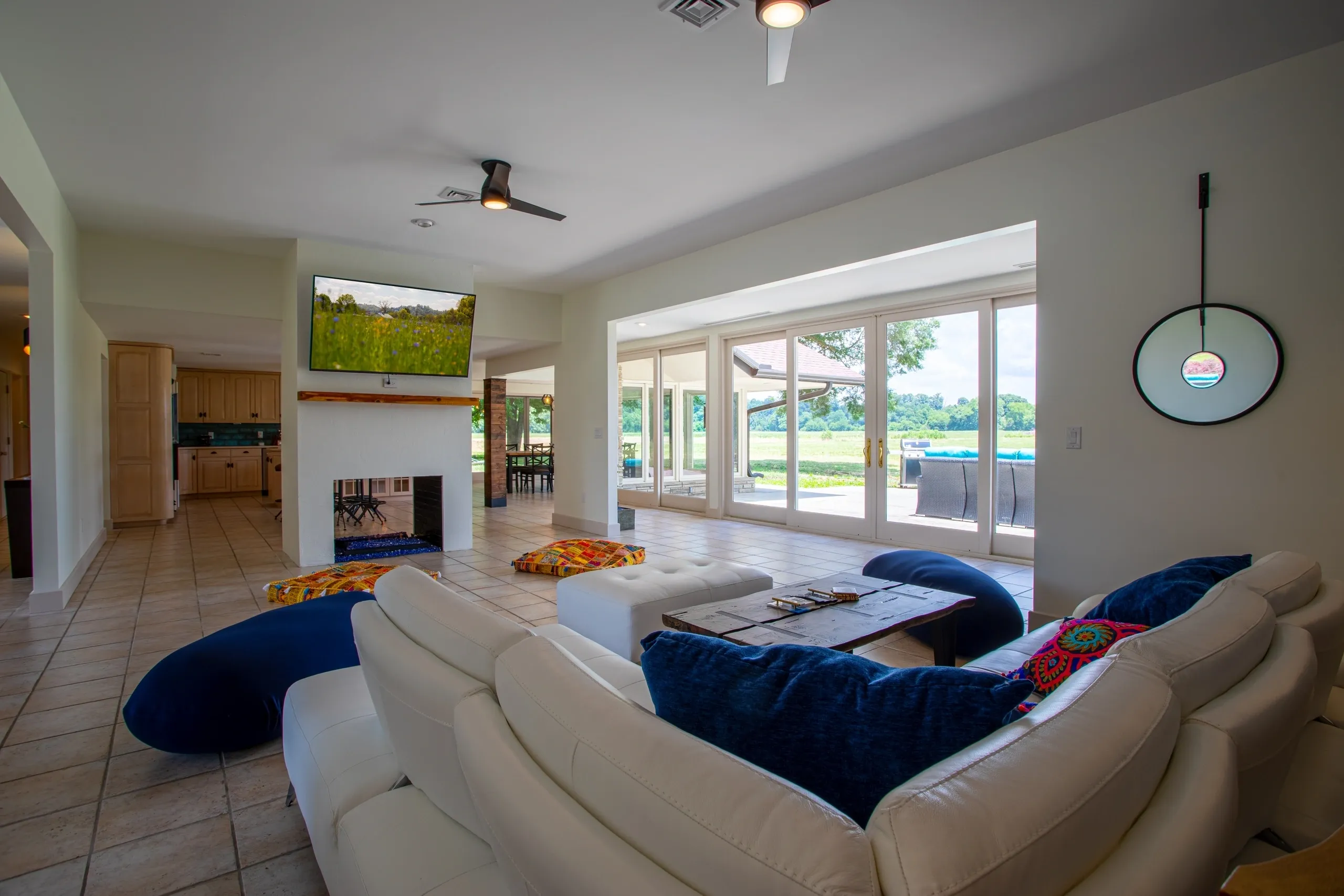 Modern living room with large windows and sofa.
