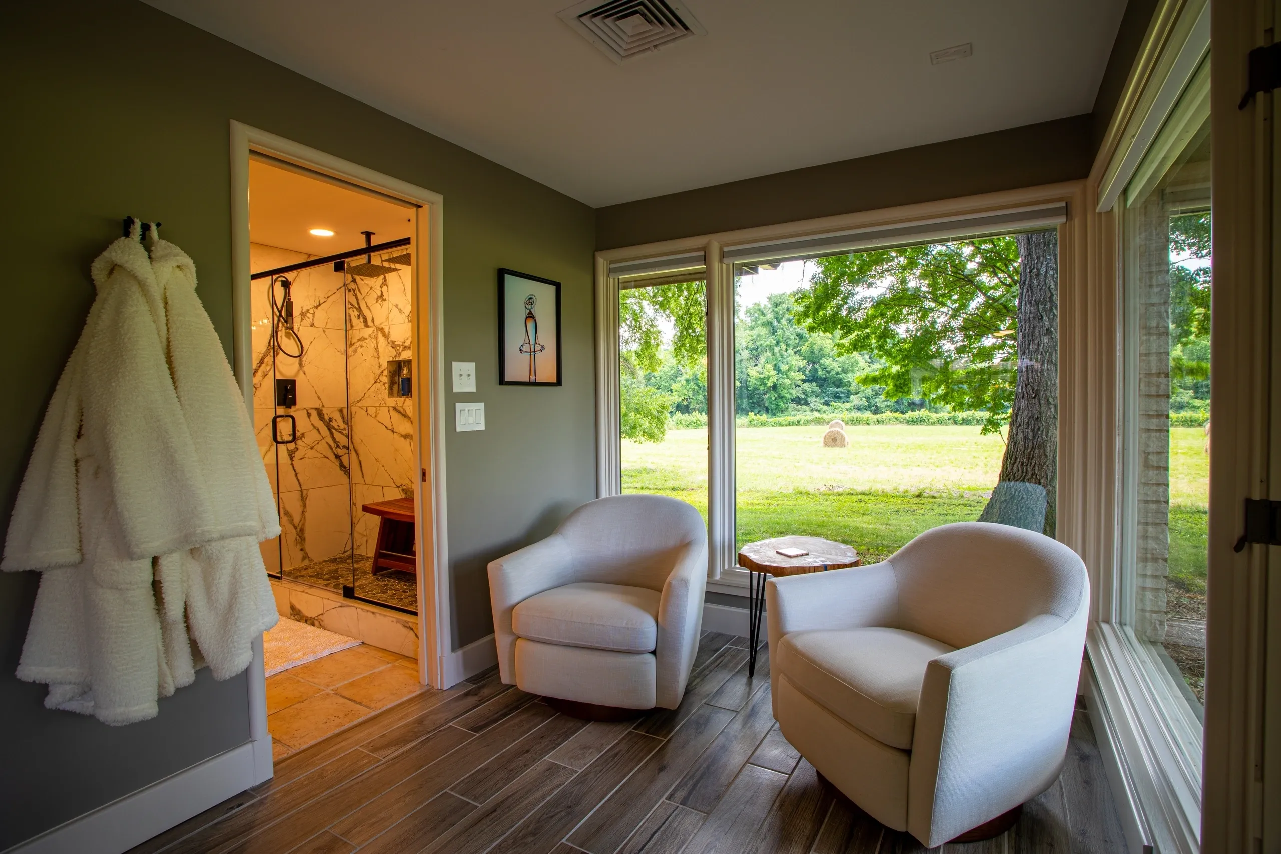 Cozy room with chairs and outdoor view.