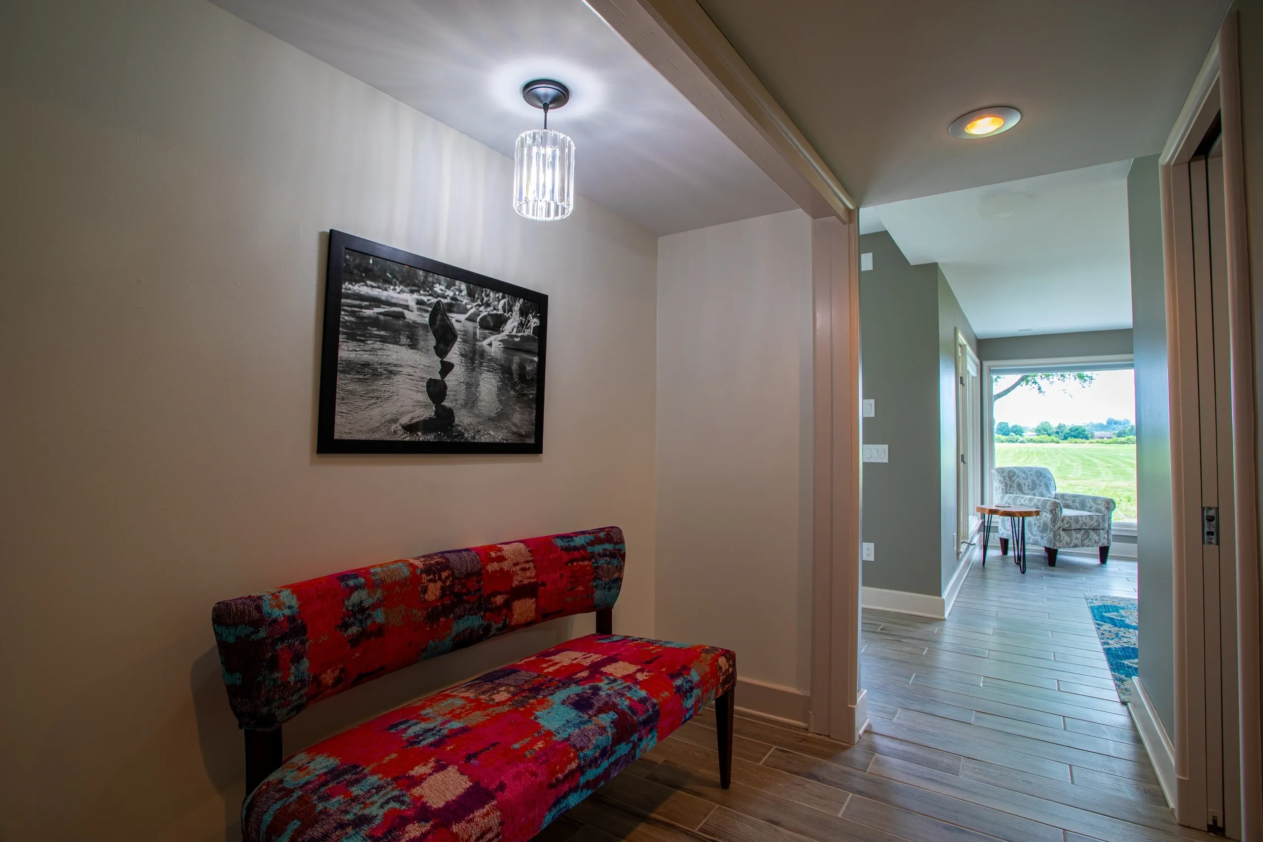 Hallway with colorful bench and artwork.