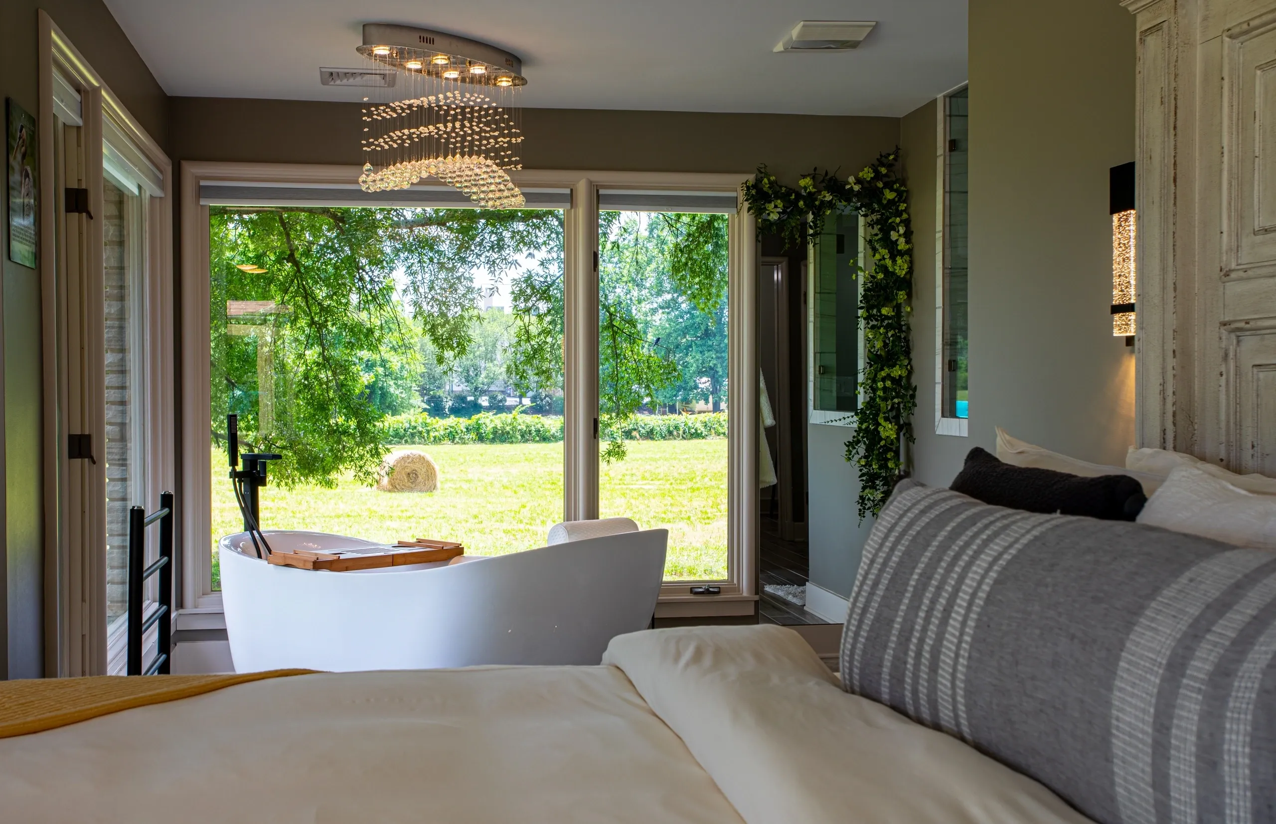 Cozy bedroom with large window view.