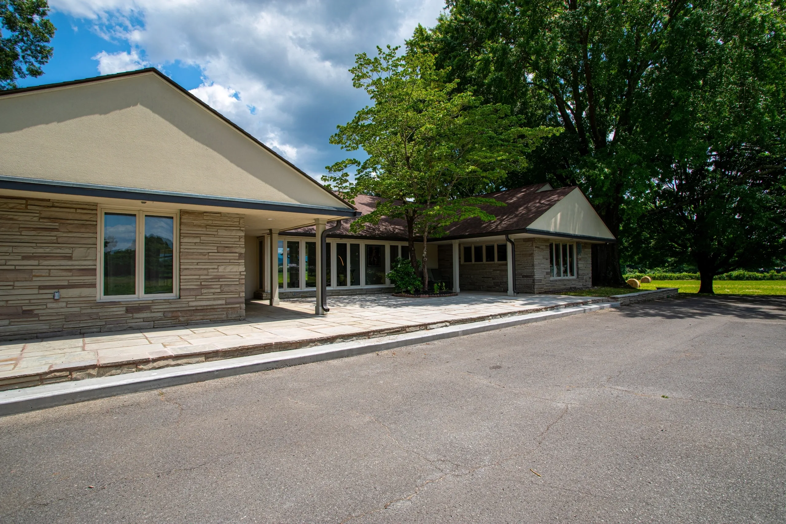 Exterior view of a house with trees.