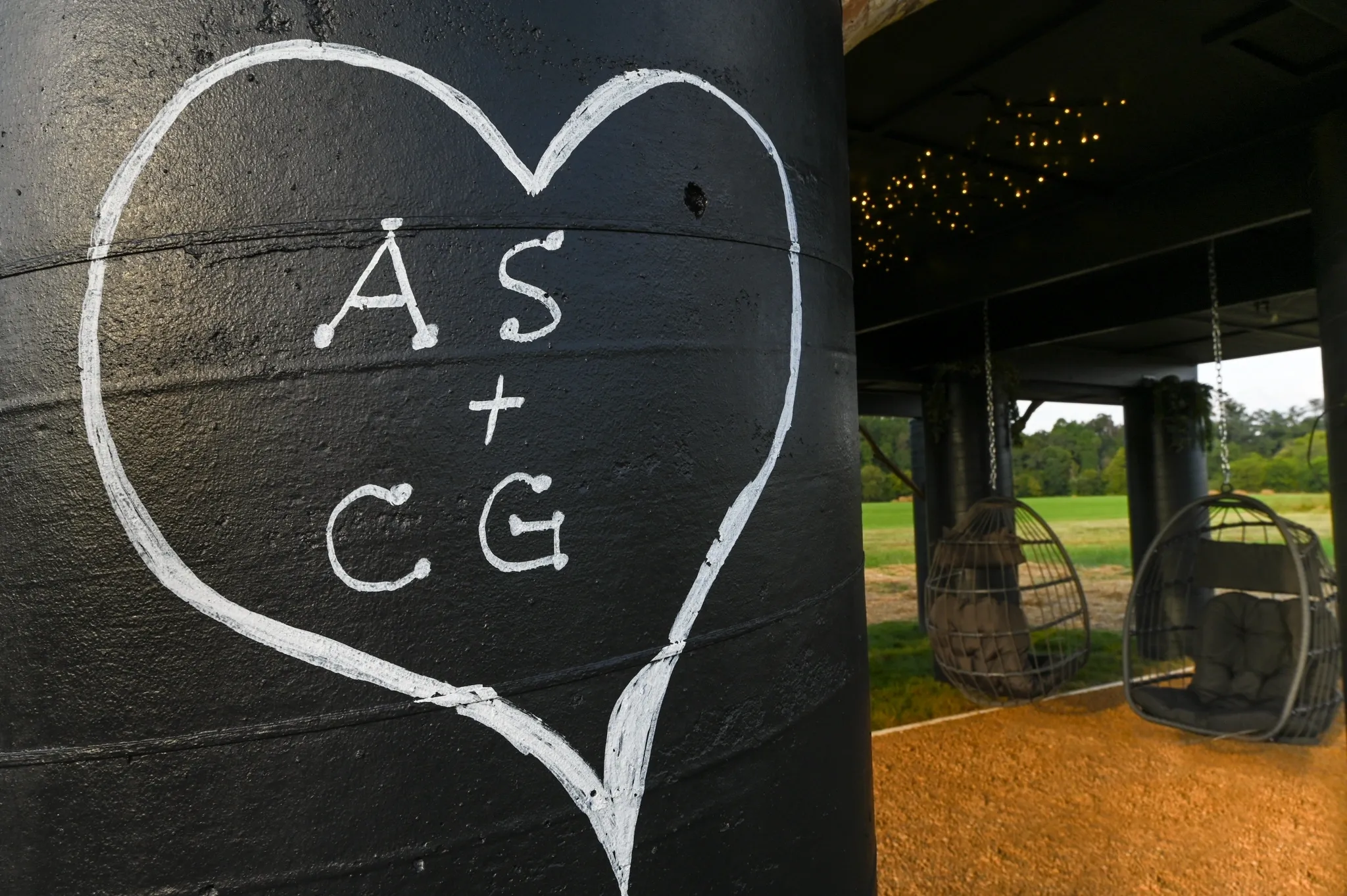Heart with initials on black pillar.