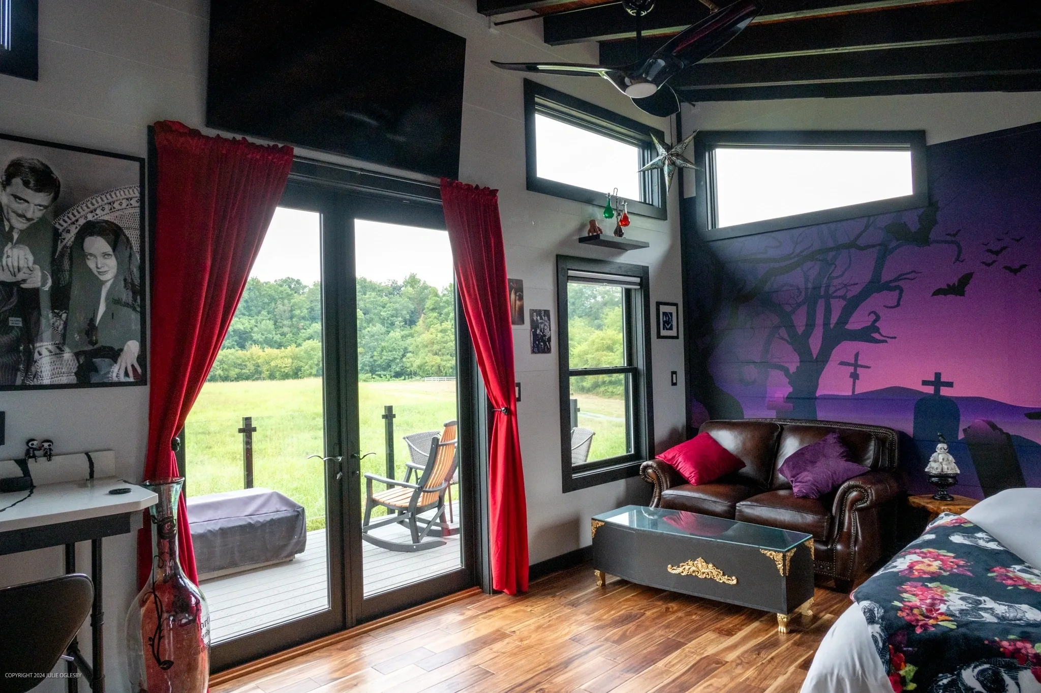 Room with gothic decor and outdoor view.