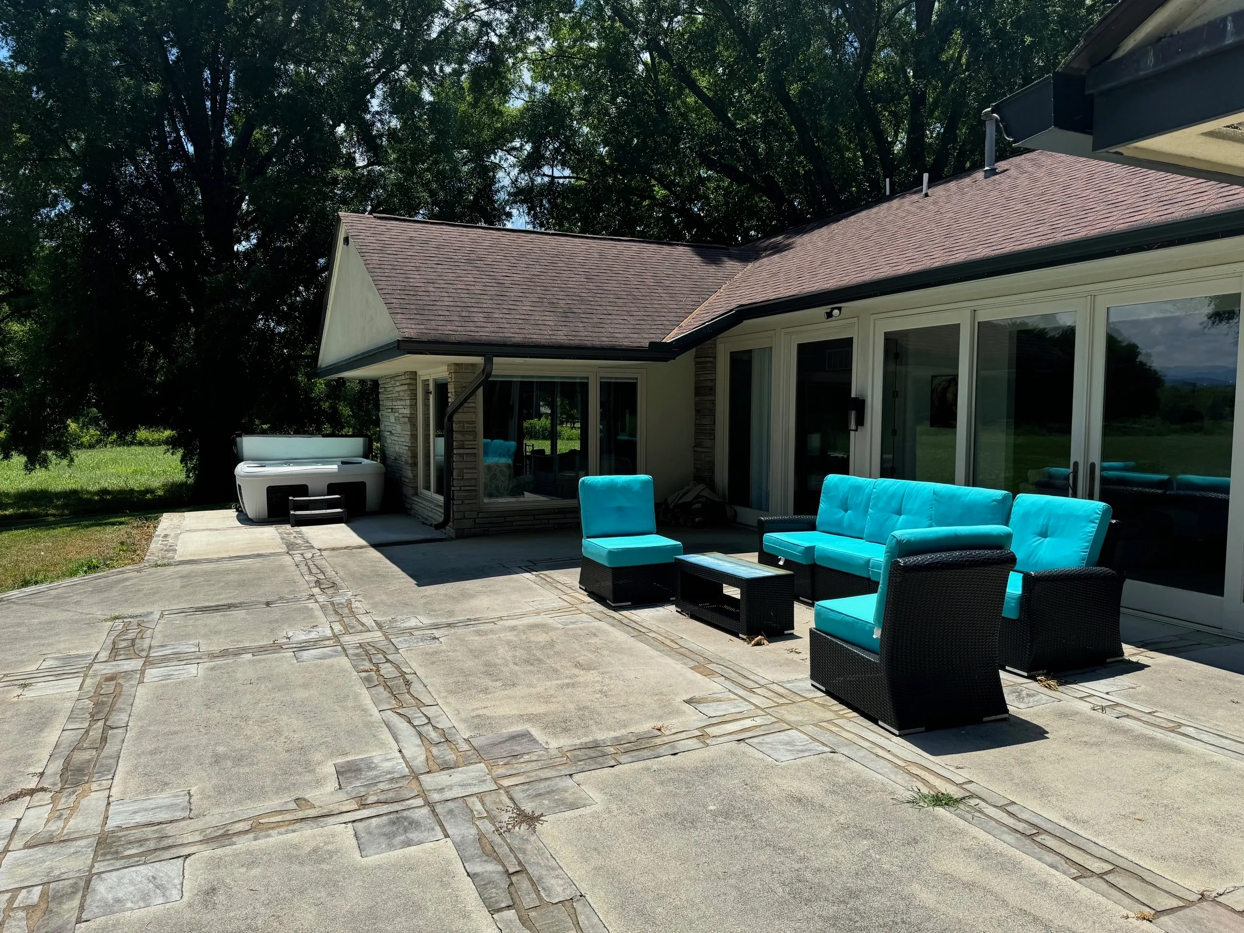 Outdoor patio with turquoise furniture.
