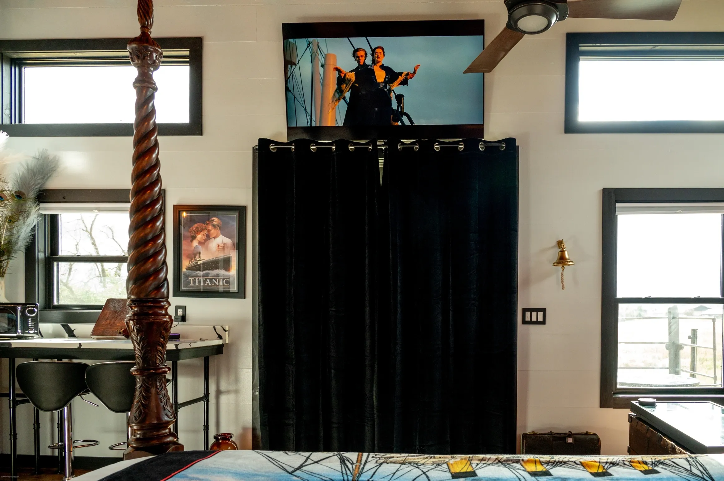 Room with Titanic movie poster and decor.